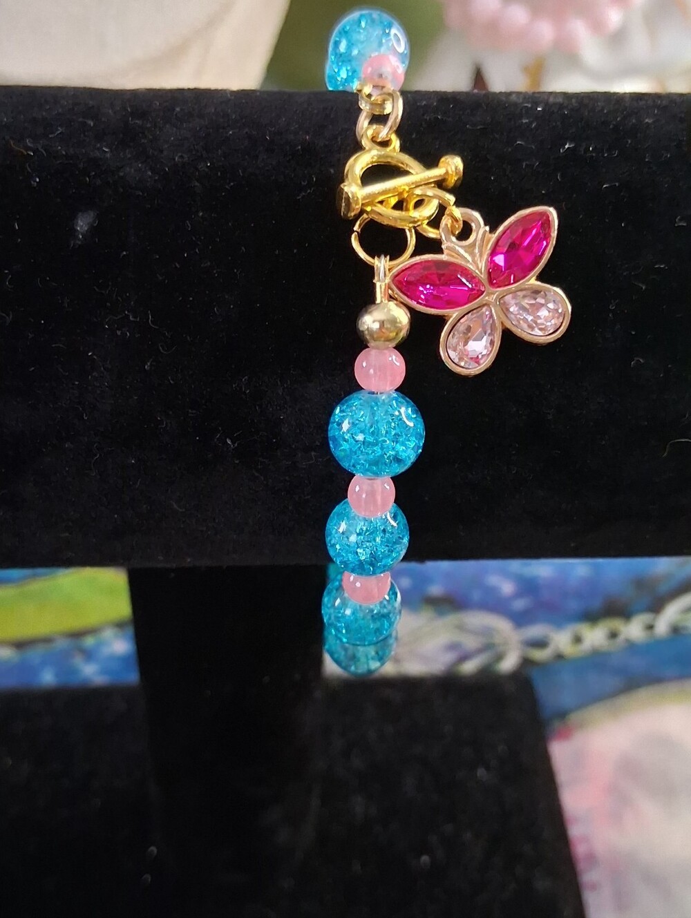 Gold Butterfly Charm Bracelet with Blue Crackle Beads and Pink Accents